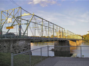 A vintage postcard of the Calhoun Street Bridge crossing the Delaware River — one of the local bridges WC4 members collect.